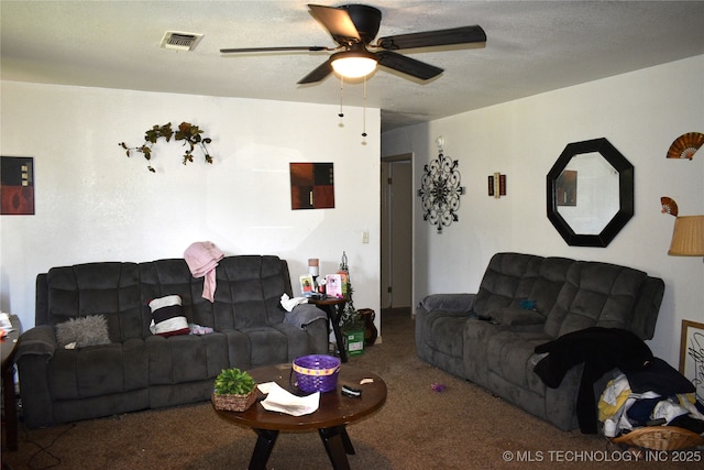 living area featuring a ceiling fan, a textured ceiling, visible vents, and carpet flooring