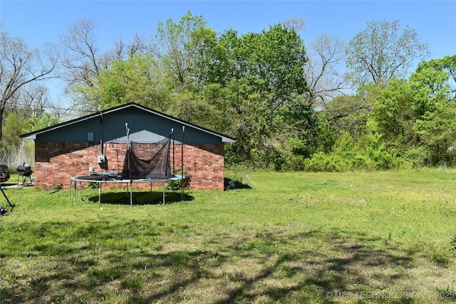 view of yard featuring a trampoline