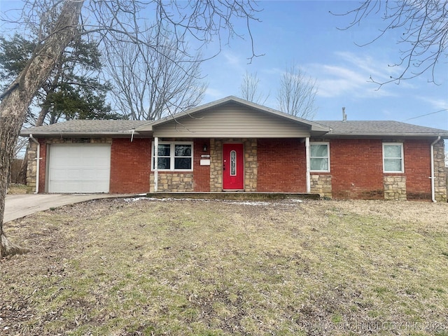 ranch-style house with driveway, stone siding, an attached garage, a front yard, and brick siding