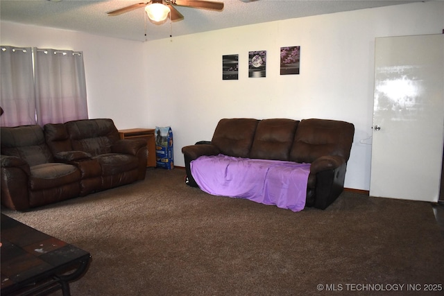 carpeted living area with ceiling fan and a textured ceiling