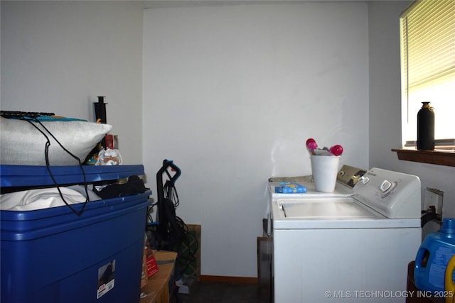 laundry room with laundry area, independent washer and dryer, and baseboards