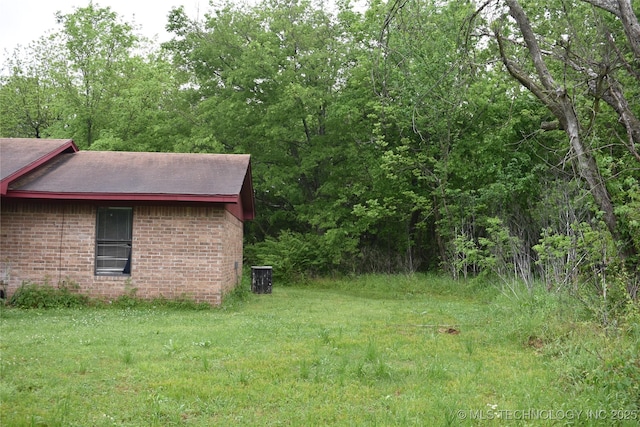 view of yard with central AC