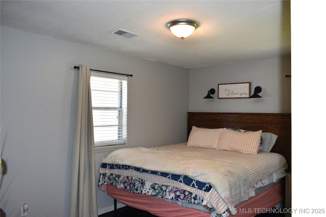 bedroom with visible vents