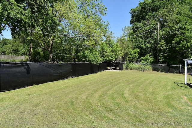 view of yard featuring fence