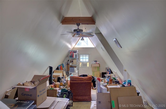 bonus room with lofted ceiling with beams and a ceiling fan