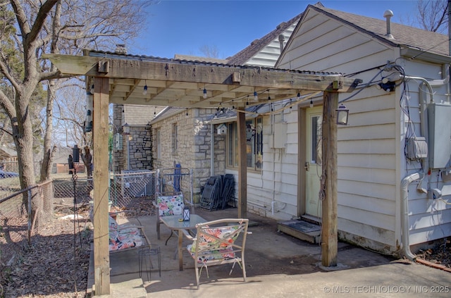 view of patio with fence and a pergola