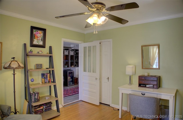 office with ceiling fan, ornamental molding, wood finished floors, and baseboards