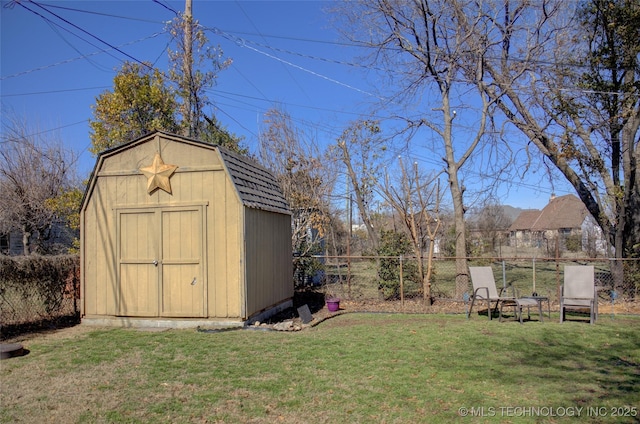 view of shed featuring a fenced backyard