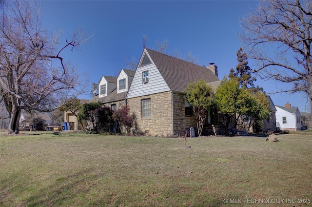 view of side of property featuring stone siding, a lawn, and a chimney