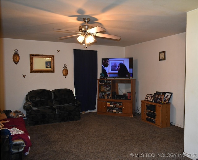 carpeted living area featuring ceiling fan