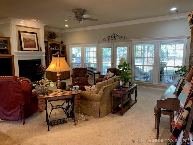 living area with ornamental molding, a fireplace, visible vents, and a healthy amount of sunlight