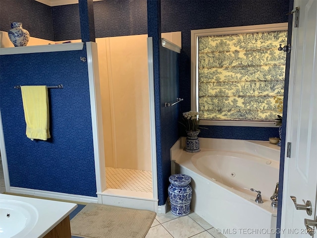 bathroom with wallpapered walls, a stall shower, vanity, a whirlpool tub, and tile patterned floors