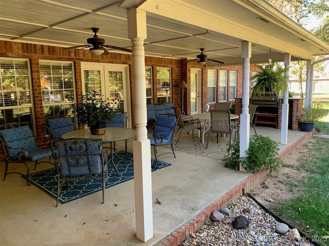 view of patio featuring outdoor dining area and a ceiling fan