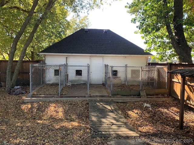 back of property featuring fence private yard and roof with shingles