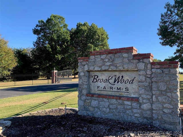 community sign with fence