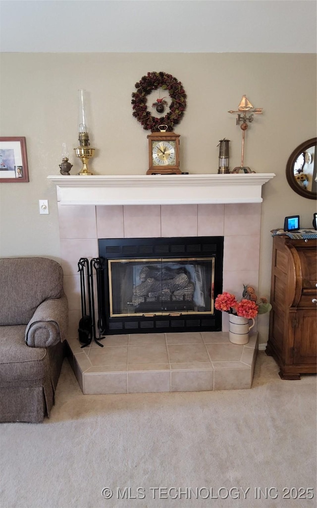 details featuring a tiled fireplace and carpet flooring