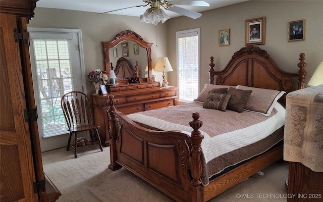 bedroom with ceiling fan and carpet flooring