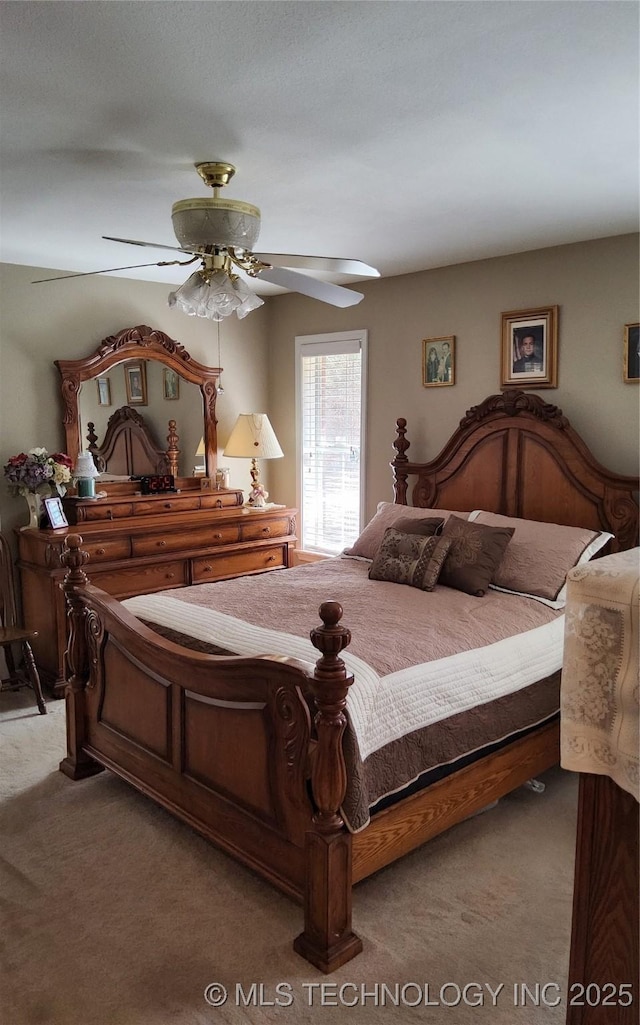 carpeted bedroom with a ceiling fan