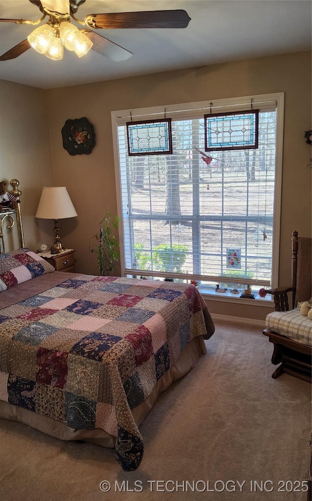 bedroom featuring carpet flooring and a ceiling fan