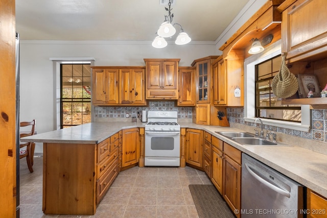 kitchen with pendant lighting, white gas range, glass insert cabinets, a sink, and dishwasher