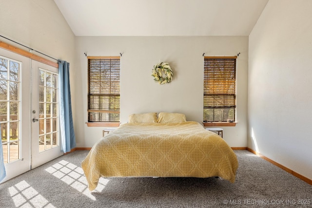 carpeted bedroom featuring access to outside, baseboards, vaulted ceiling, and french doors