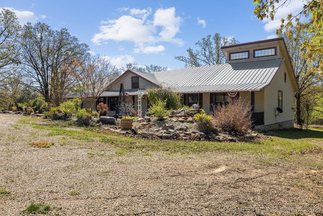 view of front facade featuring a standing seam roof and metal roof