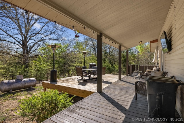 deck featuring outdoor dining area