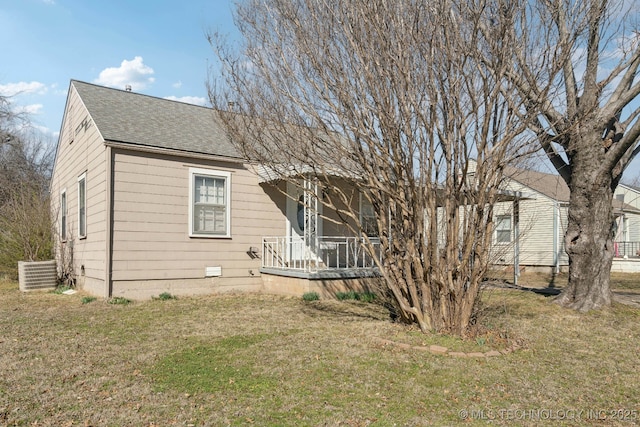 exterior space featuring a shingled roof, crawl space, a front yard, and central air condition unit