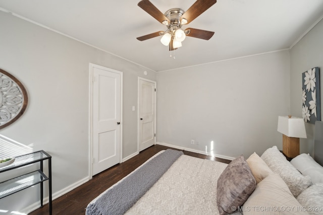 bedroom with ceiling fan, baseboards, wood finished floors, and ornamental molding