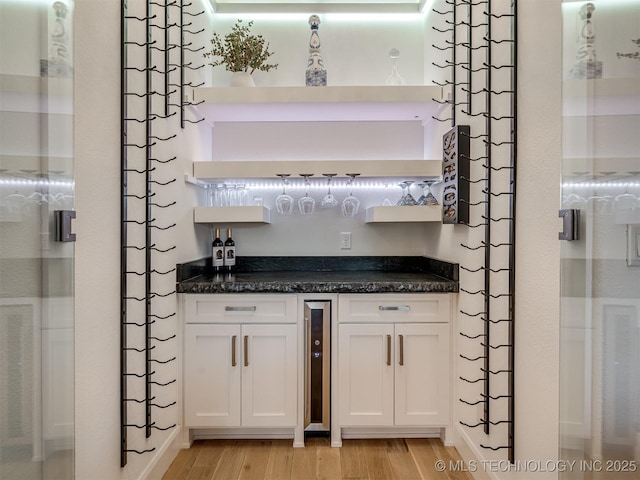 18420 E Persimmon Ln, Owasso, OK 74055 - indoor dry bar featuring light wood-type flooring and beverage cooler