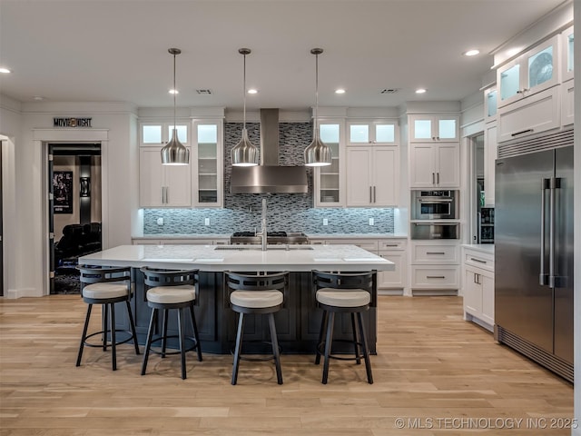 18420 E Persimmon Ln, Owasso, OK 74055 - kitchen featuring stainless steel appliances, wall chimney range hood, a warming drawer, decorative backsplash, and recessed lighting