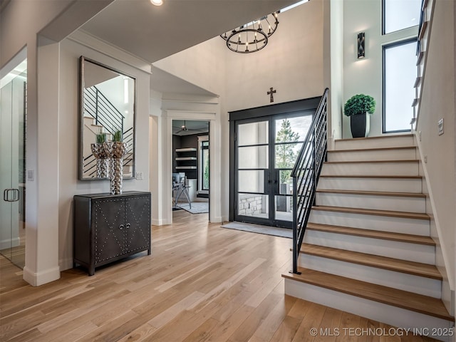 18420 E Persimmon Ln, Owasso, OK 74055 - foyer entrance featuring stairs, light wood-type flooring, french doors, a chandelier, and recessed lighting