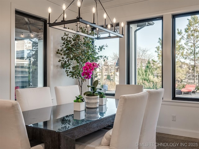 18420 E Persimmon Ln, Owasso, OK 74055 - dining space featuring a chandelier and baseboards