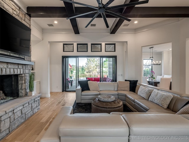 18420 E Persimmon Ln, Owasso, OK 74055 - living room featuring light wood-style floors, coffered ceiling, a fireplace, beamed ceiling, and a chandelier