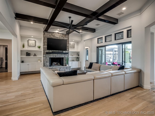 18420 E Persimmon Ln, Owasso, OK 74055 - living room featuring light wood finished floors, coffered ceiling, a ceiling fan, a fireplace, and beamed ceiling