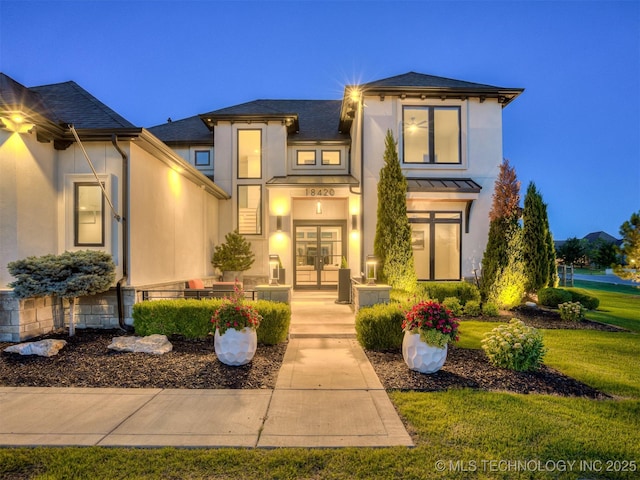 18420 E Persimmon Ln, Owasso, OK 74055 - view of front of house featuring french doors, stucco siding, a standing seam roof, a metal roof, and a front yard