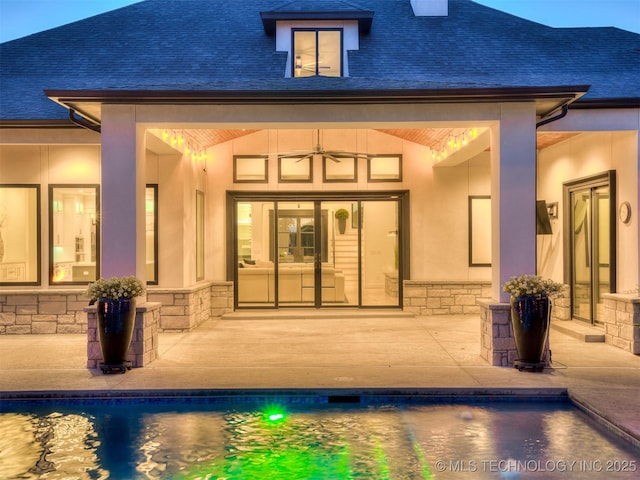 18420 E Persimmon Ln, Owasso, OK 74055 - back of property featuring a patio, stone siding, and an outdoor pool