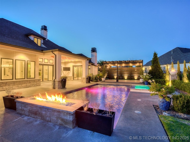 18420 E Persimmon Ln, Owasso, OK 74055 - outdoor pool featuring an outdoor fire pit, a pergola, and a patio area
