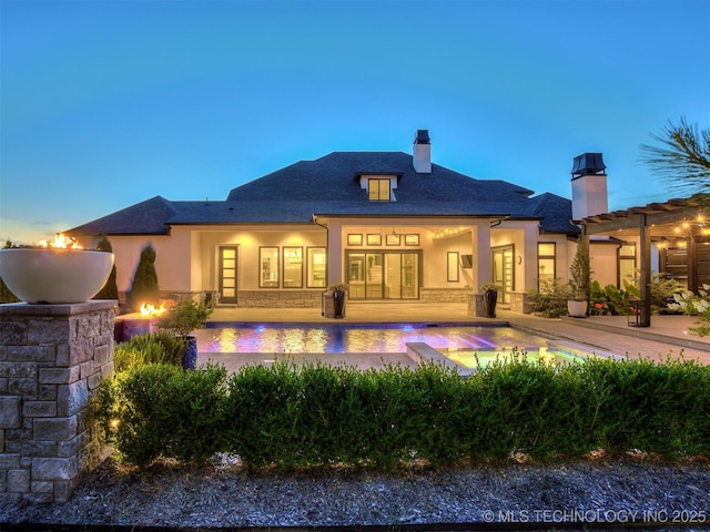 18420 E Persimmon Ln, Owasso, OK 74055 - back of house featuring a chimney, an outdoor pool, stucco siding, and a patio area