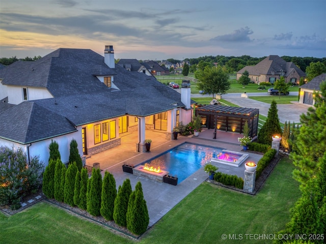 18420 E Persimmon Ln, Owasso, OK 74055 - rear view of house featuring a chimney, a shingled roof, and an in-ground hot tub