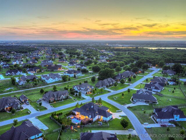 18420 E Persimmon Ln, Owasso, OK 74055 - aerial view at dusk of a residential view