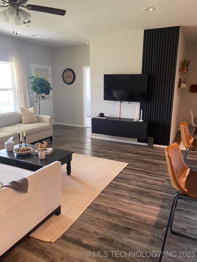 living room with dark wood-style floors, recessed lighting, baseboards, and a ceiling fan