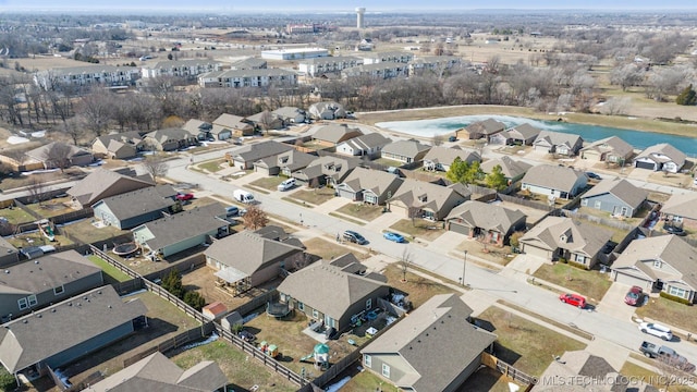 aerial view featuring a water view and a residential view