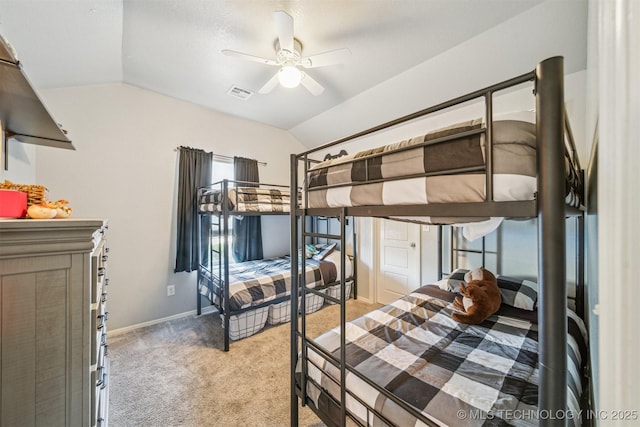 bedroom with lofted ceiling, light colored carpet, a ceiling fan, baseboards, and visible vents