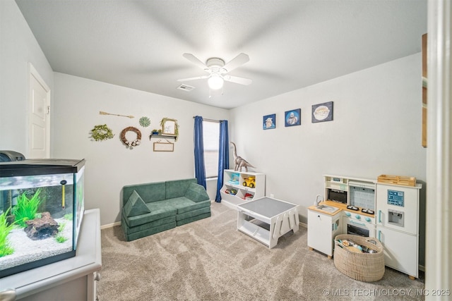 game room featuring ceiling fan, carpet floors, visible vents, and baseboards