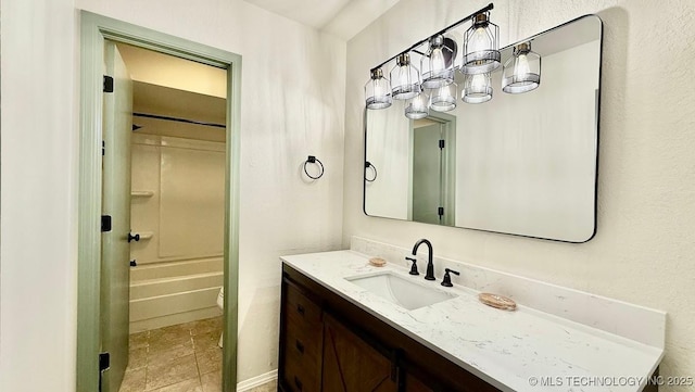 bathroom with washtub / shower combination and vanity