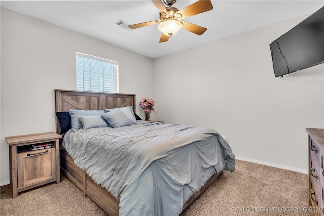 bedroom with light carpet, baseboards, visible vents, and ceiling fan