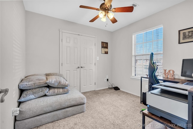 office space featuring ceiling fan, carpet floors, visible vents, and baseboards