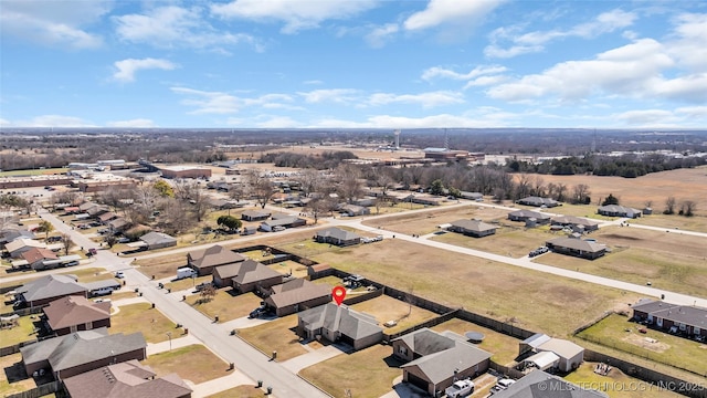 birds eye view of property with a residential view