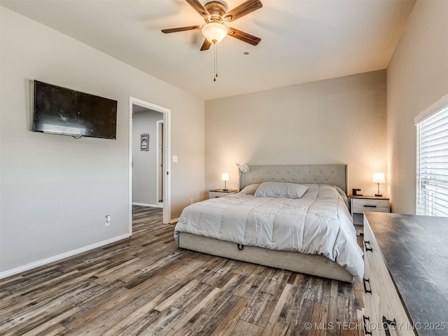 bedroom featuring dark wood-style floors, baseboards, and a ceiling fan